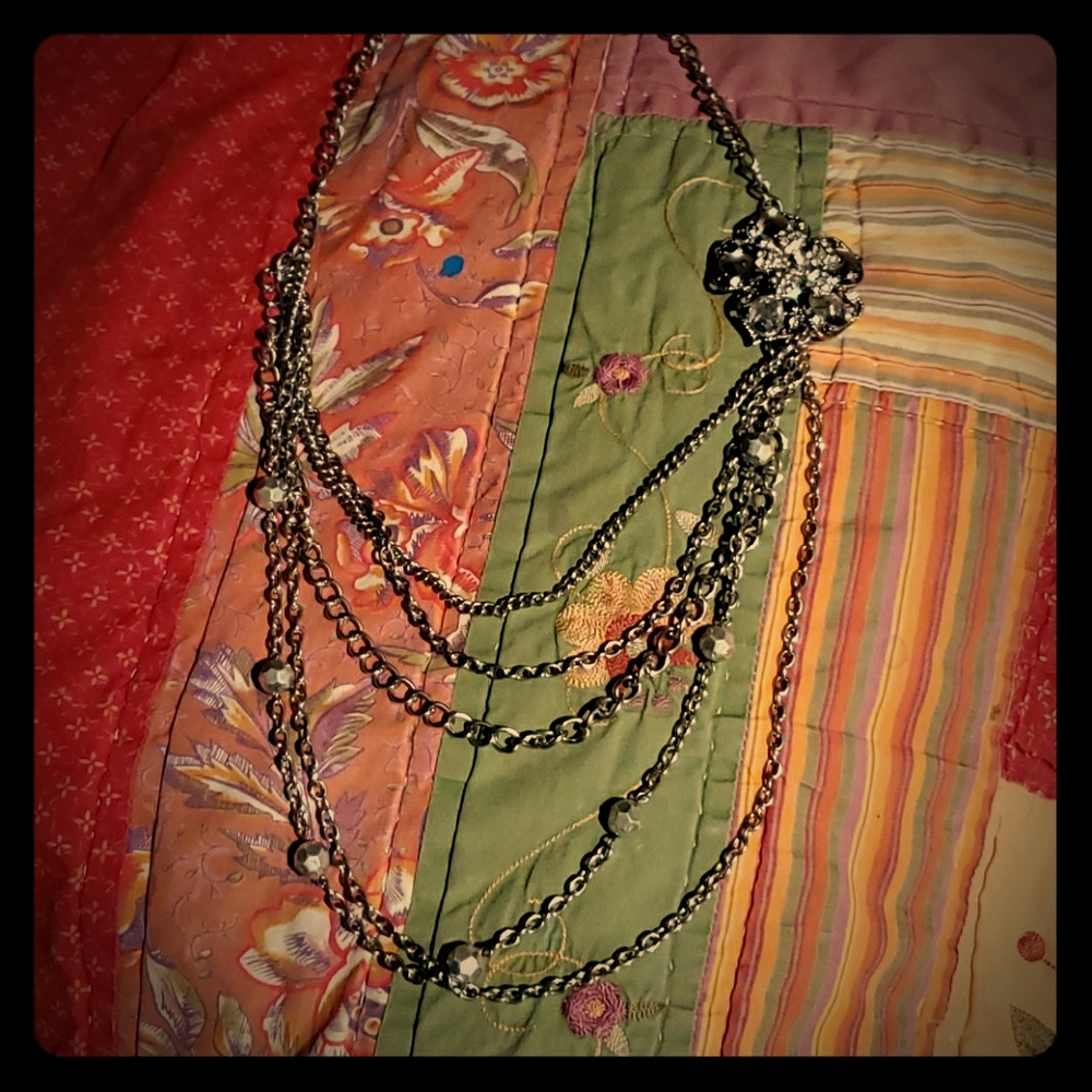 Silver toned multi strand statement necklace